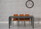 Extending grey glass dining table and 4 orange chairs