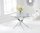 120cm round glass dining table and 6 grey chairs