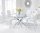 120cm round glass dining table and 6 white chairs