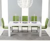 Extending white high gloss dining table and 12 green chairs