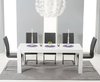 Extending white high gloss dining table and 12 grey chairs