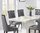 Stylish white marble dining table with 6 grey chairs