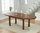 Dark oak dining table and 8 grey fabric chairs