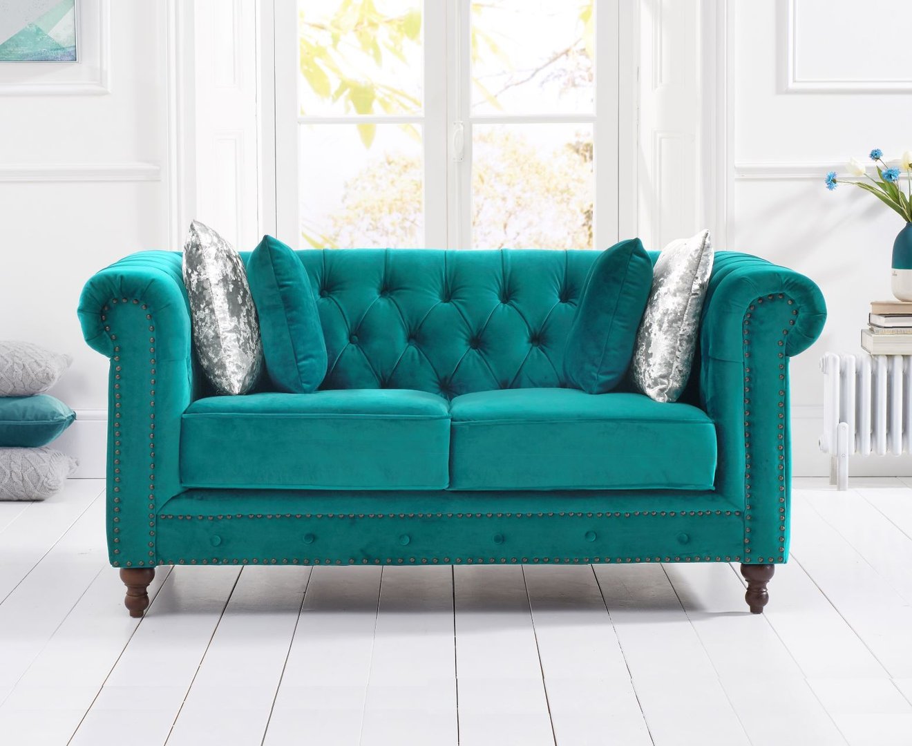 Stylish teal velvet 2 seater sofa with stud detail