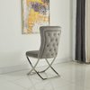 Light grey velvet dining chairs with crossed base